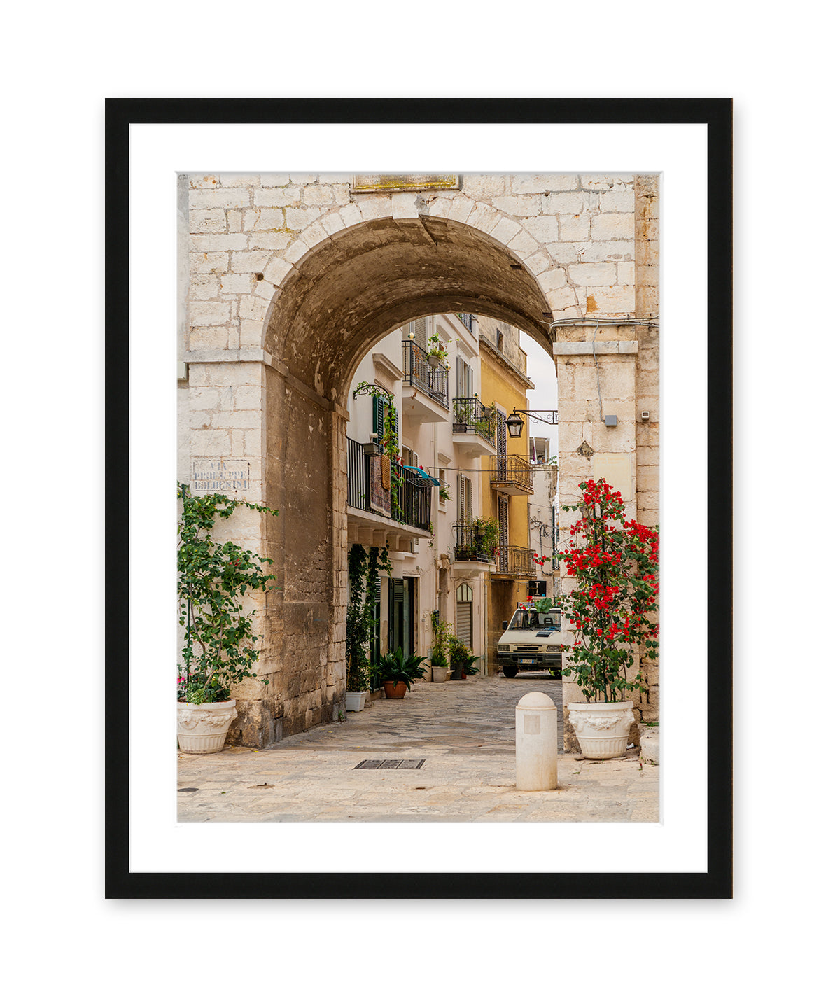 Italy photogrpahy featuring Stone arch and city view in conversano, puglia in black frame