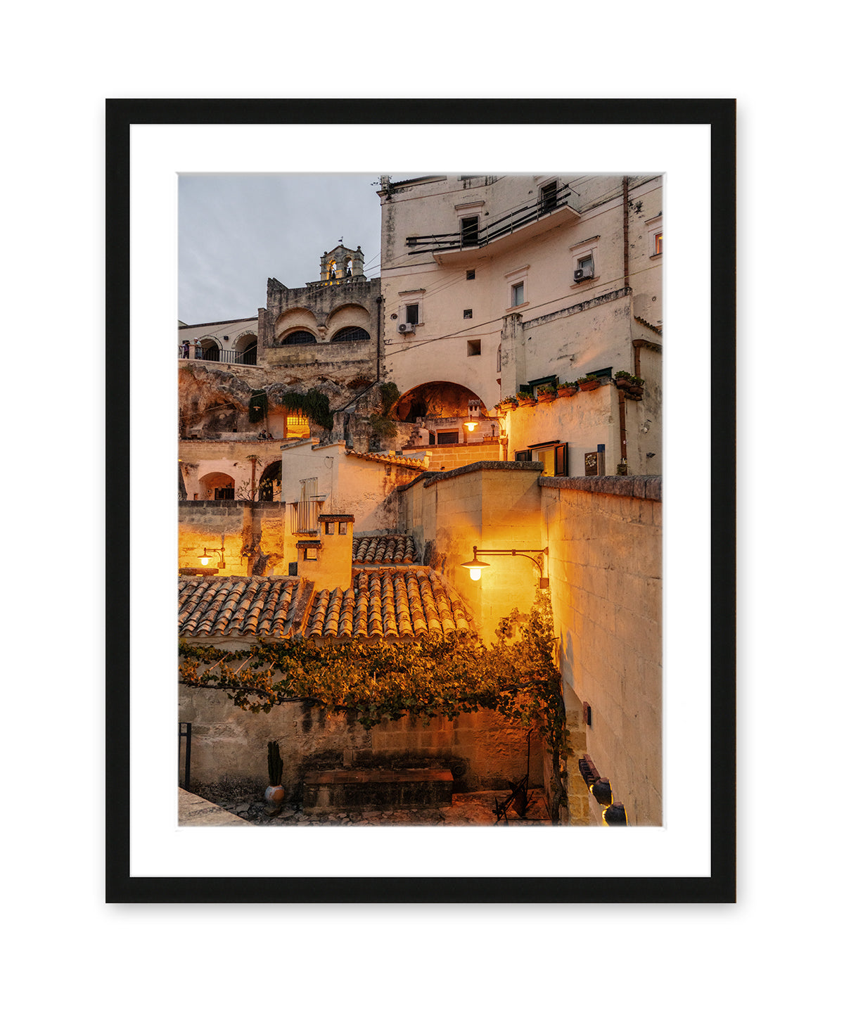 black framed italy photograph feautring Italian architecture at twilight with warm streetlight glow and intricate building details.