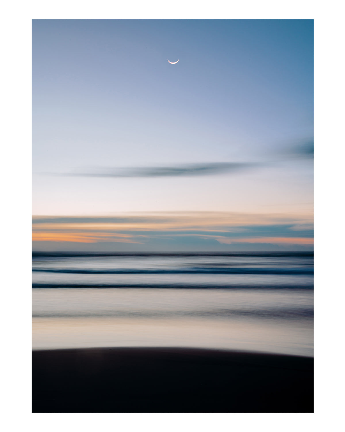 abstract blue beach photograph with half moon