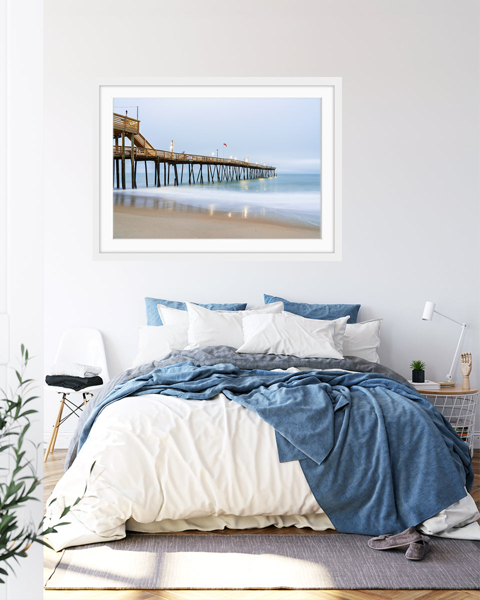 blue bedroom decor featuring framed blue pier wall art photograph by Wright and Roam