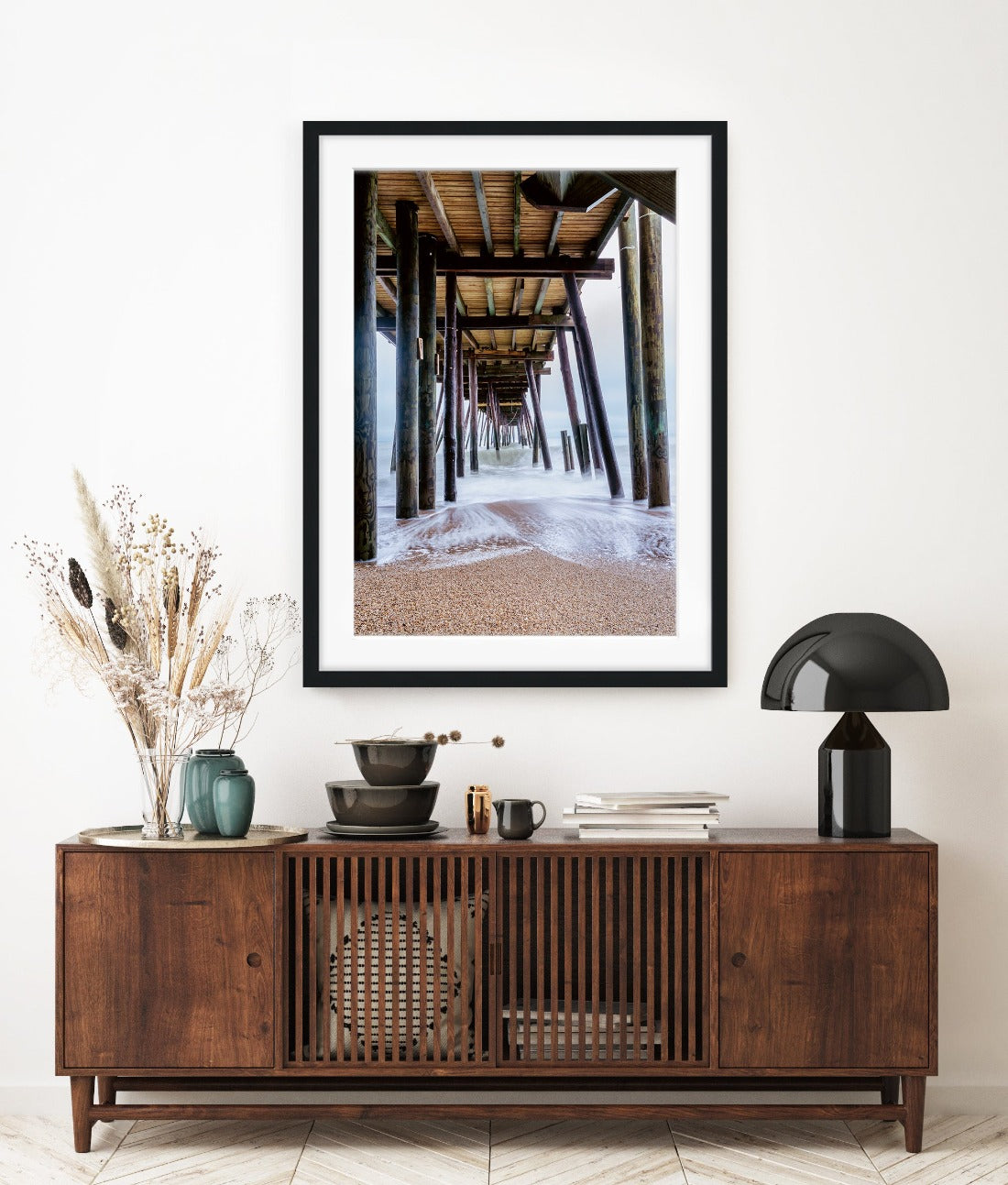 Modern entryway decor featuring large framed beach wall art by Wright and Roam