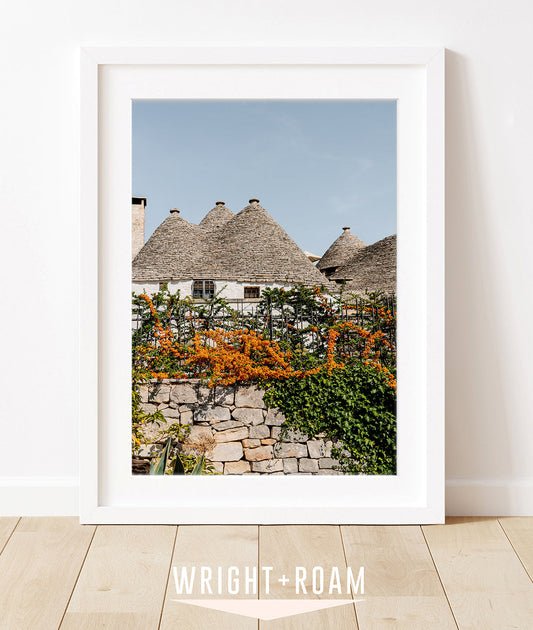 italy wall art in white frame. Photograph features the trulli houses in Alberobello