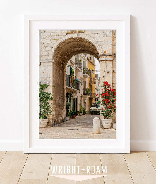 framed photograph featuring stone arch in conversano, puglia italy
