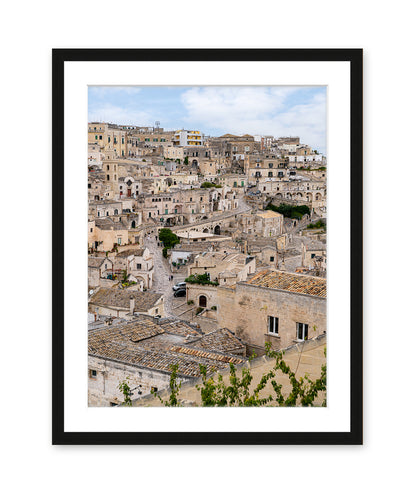 Matera Italy photograph featuring neutral stone streets in a black wood frame.