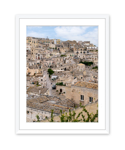 Matera Italy photograph featuring neutral stone streets in a white wood frame.