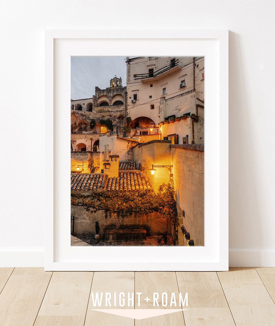 Fine art Photograph of historic Italian buildings at twilight, illuminated by warm amber streetlights, highlighting textured stone facades.