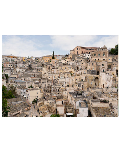 Unframed horizontal Matera architecture print showcasing layered stone buildings and textured facades.