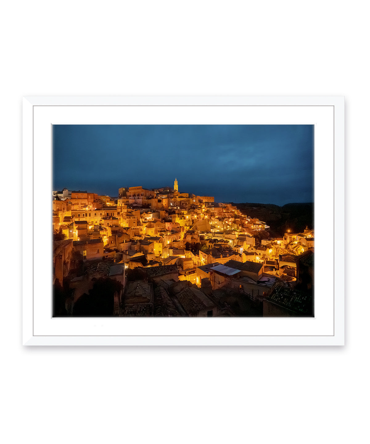 italy wall art feautring Matera, italy at night with golden historic streets and Navy sky in a white frame