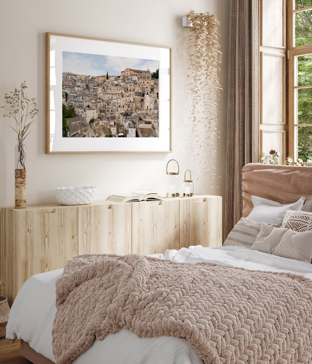 framed italy photograph feautring neutral tones and stone architecture of Matera in a travel-inspired neutral decor bedroom.