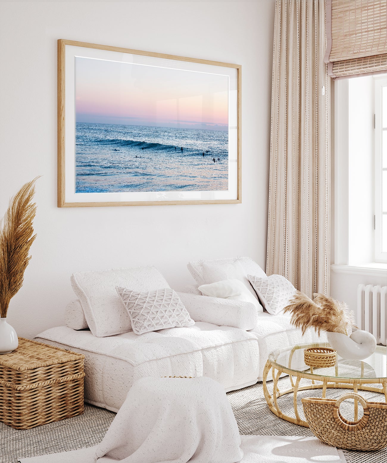 boho coastal decor with large framed ocean photograph