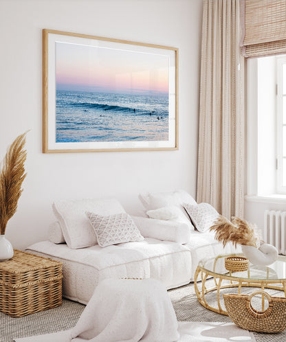 boho coastal decor with large framed ocean photograph