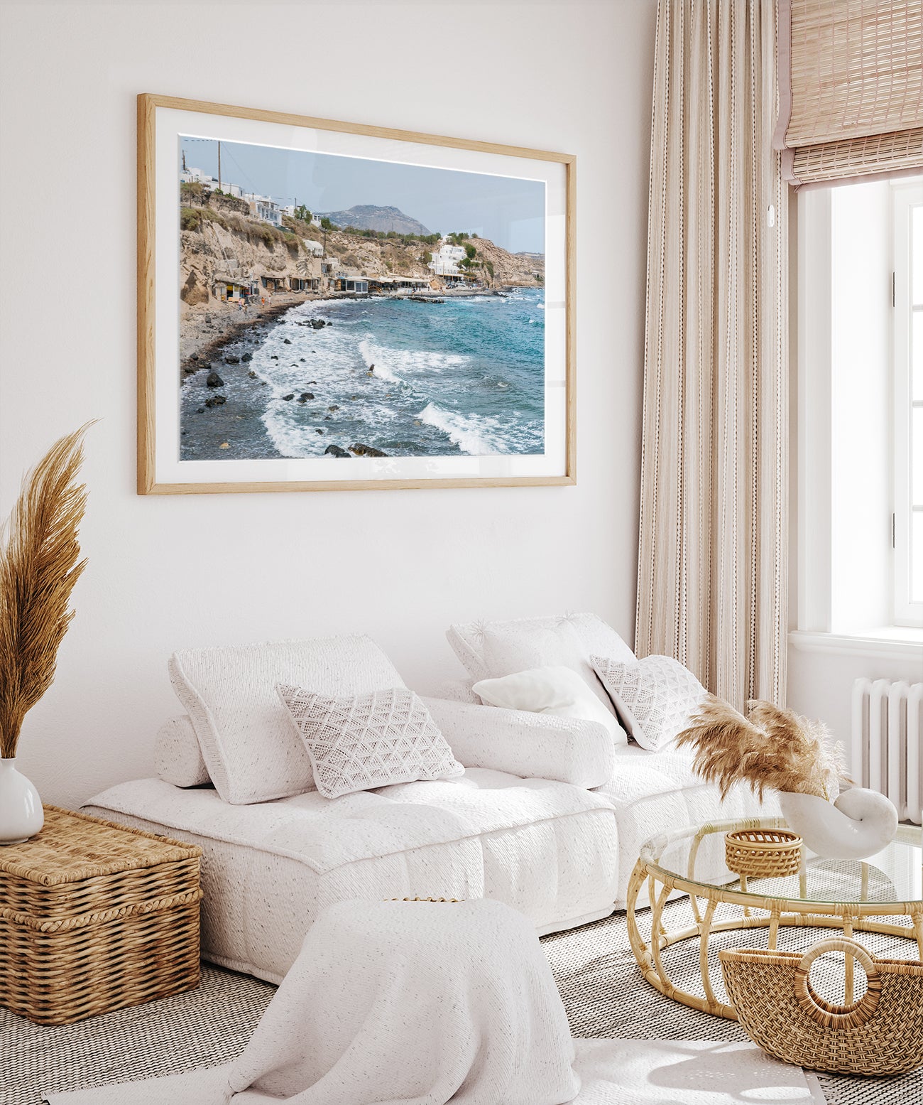 boho coastal living room decor with large framed greece beach photograph