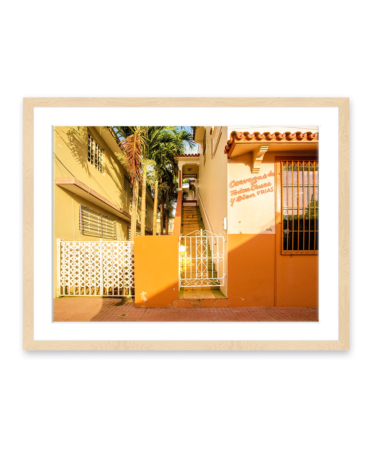 Colorful architecture photography featuring orange buildings in Rincon, Puerto Rico, natural wood frame