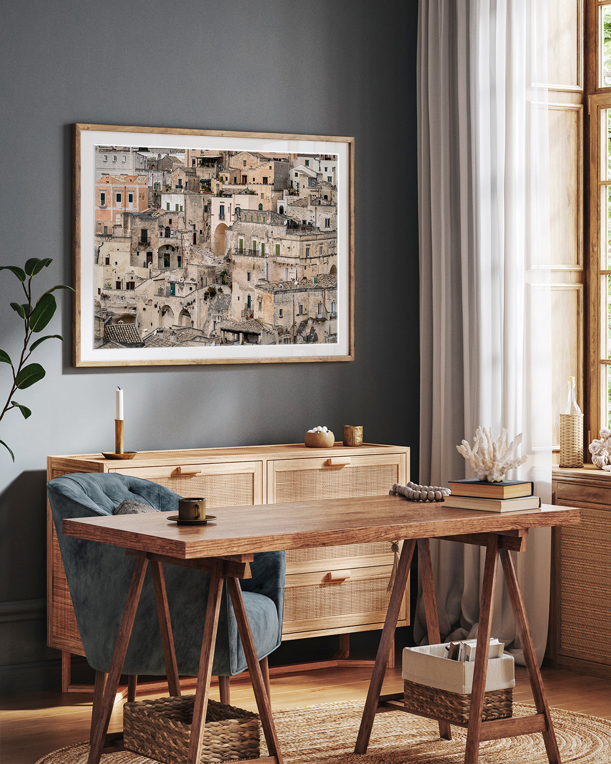 Matera Italy architecture wall art framed in an office with dark walls and neutral wood accents.