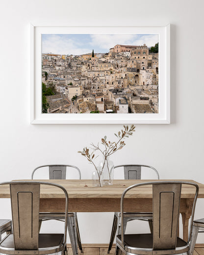 Matera Italy landscape wall art displayed in a neutral dining room interior, highlighting historic stone architecture.