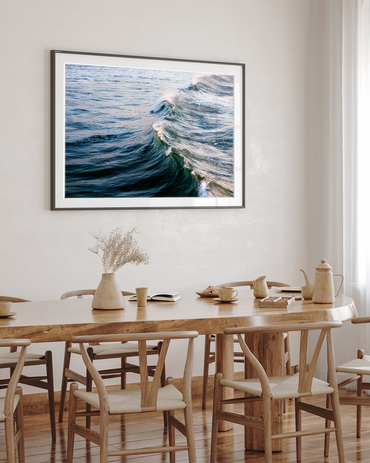 minimal dining room decor featuring large ocean wave print
