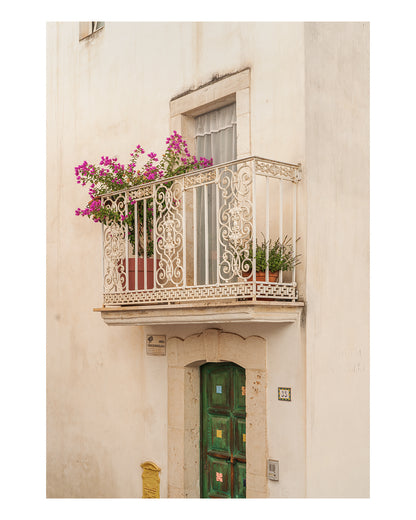 minimal wall art featuring streets in italy - a close up textured wall with window and cream iron blacony.