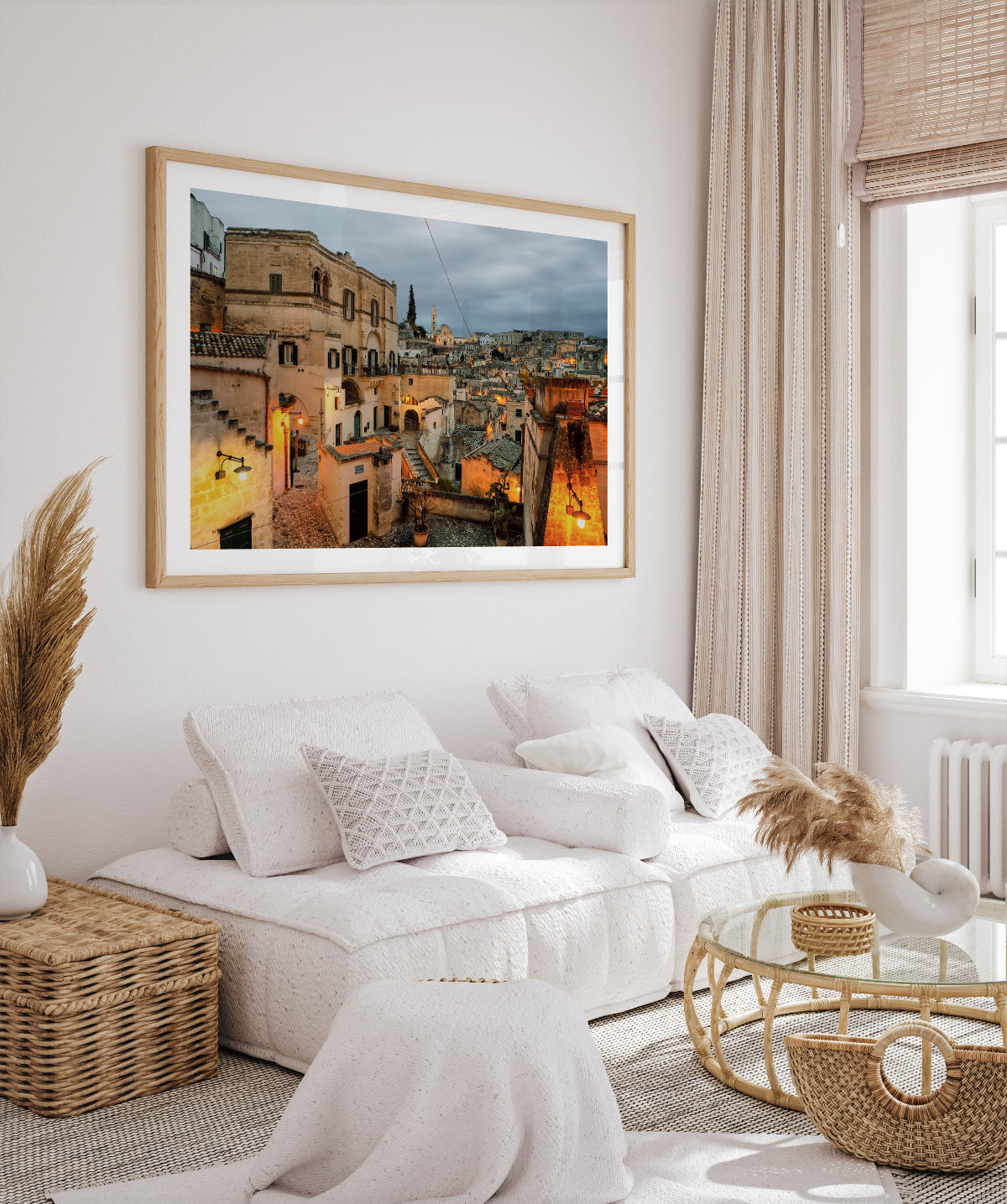 framed italy art featuring Matera, Italy at night displayed in a European inspired neutral living room.