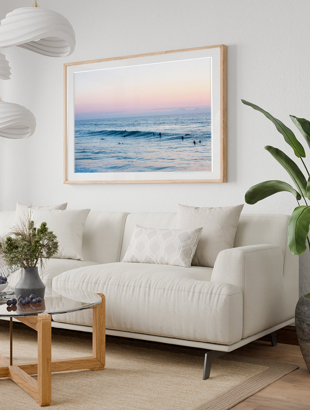 modern coastal decor with large framed blue ocean photograph