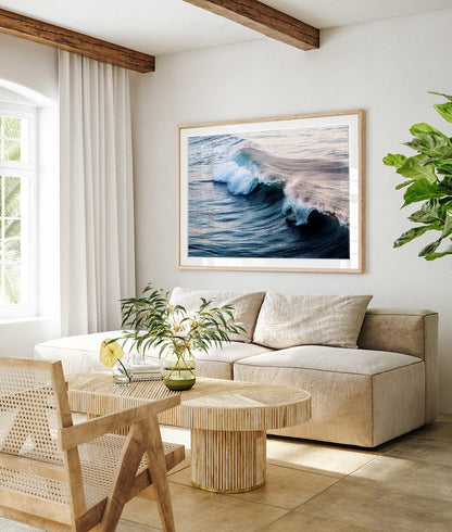 modern coastal decor featuring large framed wave photograph