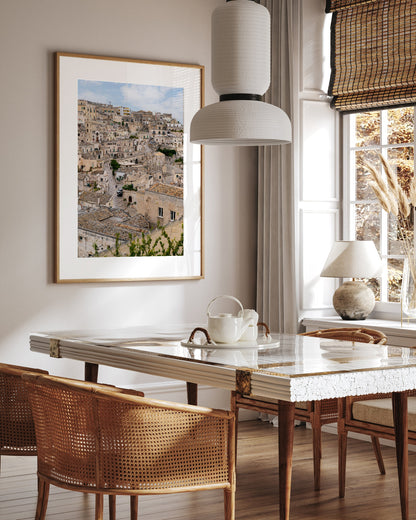 Matera Italy photograph displayed in a neutral travel-inspired dining room