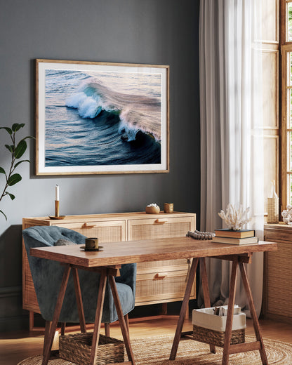 Moody office decor with framed photograph of a deep indigo blue wave