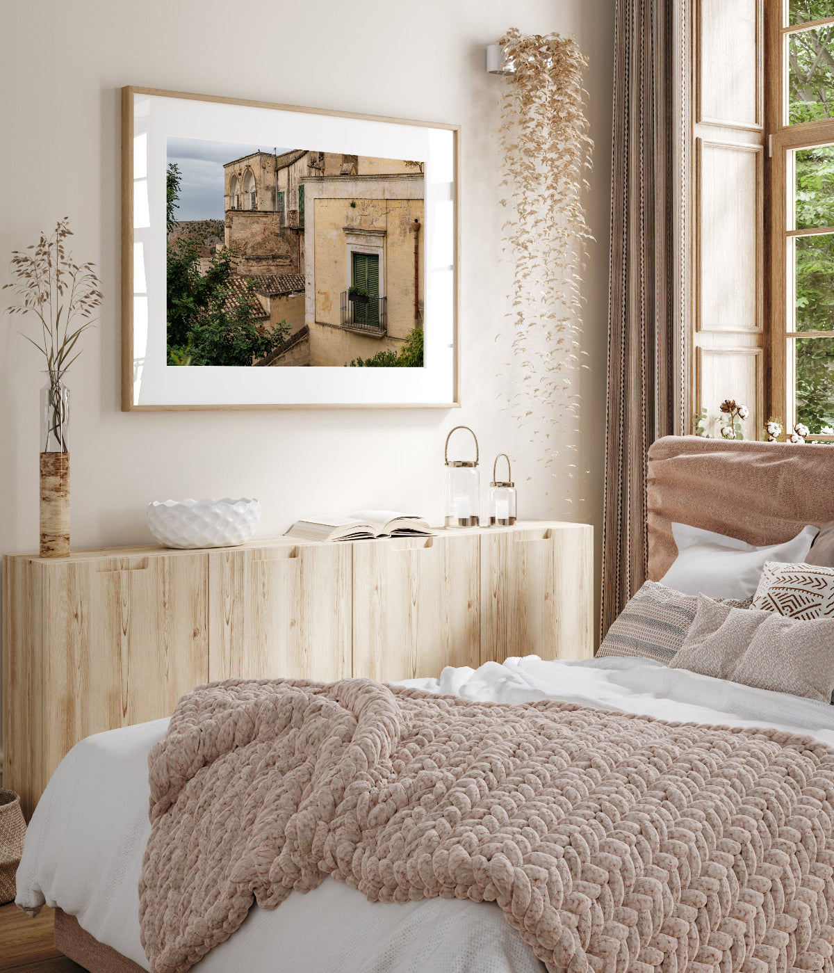 framed Southern Italy photograph in a neutral old world style bedroom.