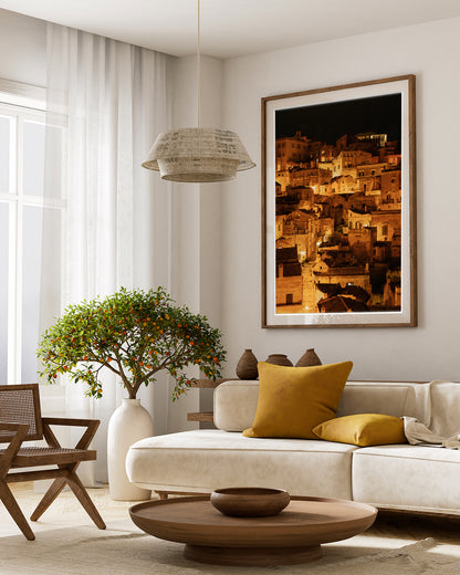 Old World Inspired Decor featuring framed fine art photograph of Historic city of Matera, Italy at night with glowing amber lights.