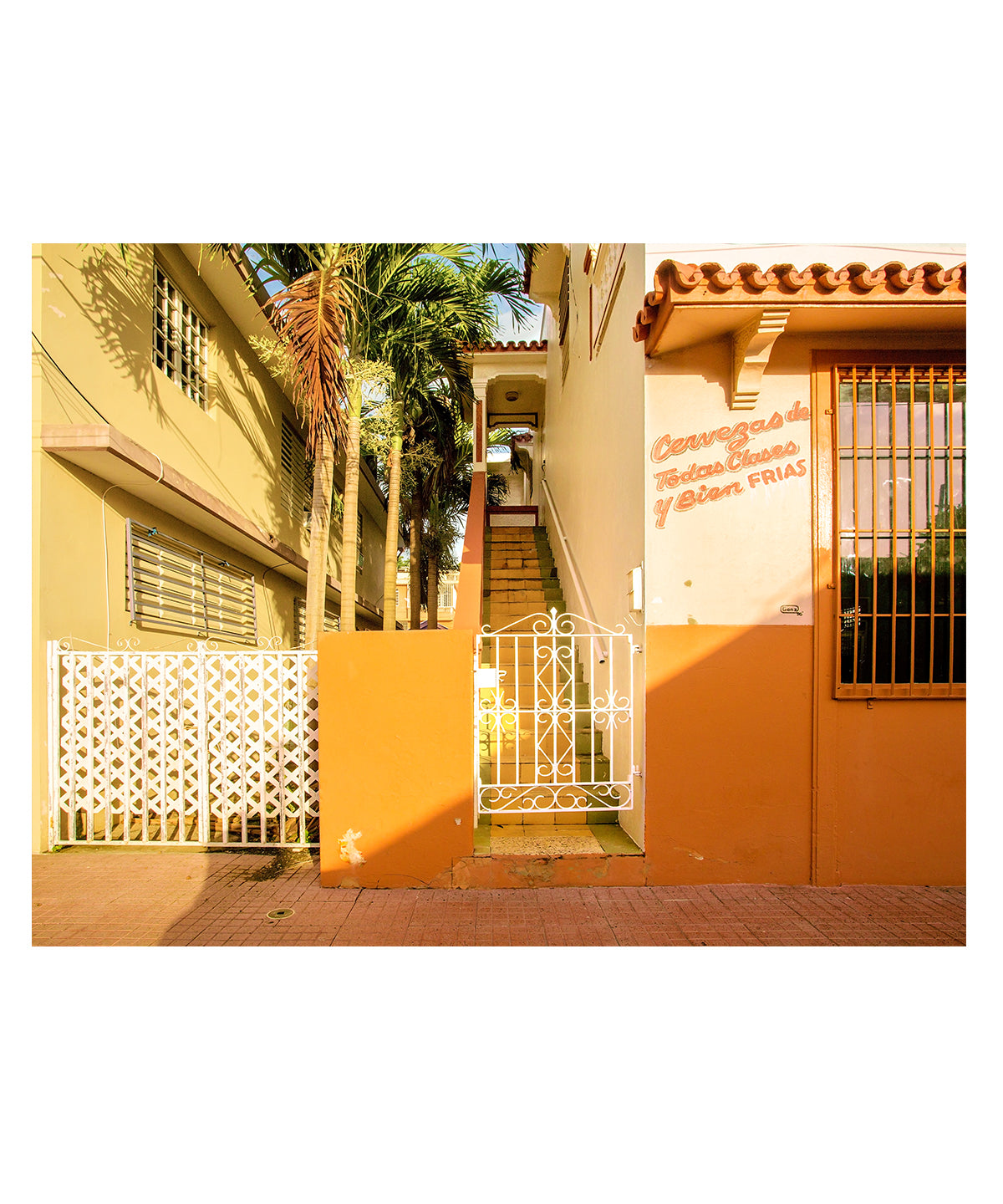 Colorful architecture photography feautring orange buildings in Rincon, Puerto Rico.