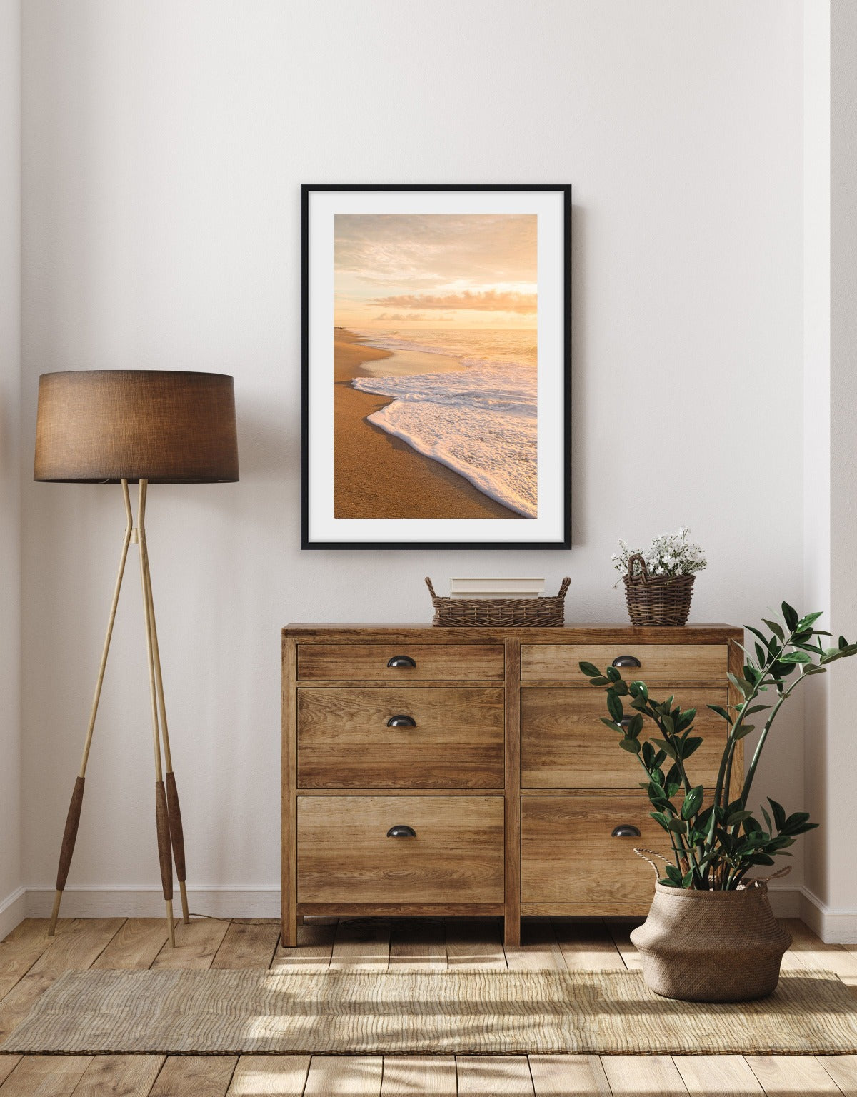 modern bedroom decor featuring warm sunrise beach photograph framed